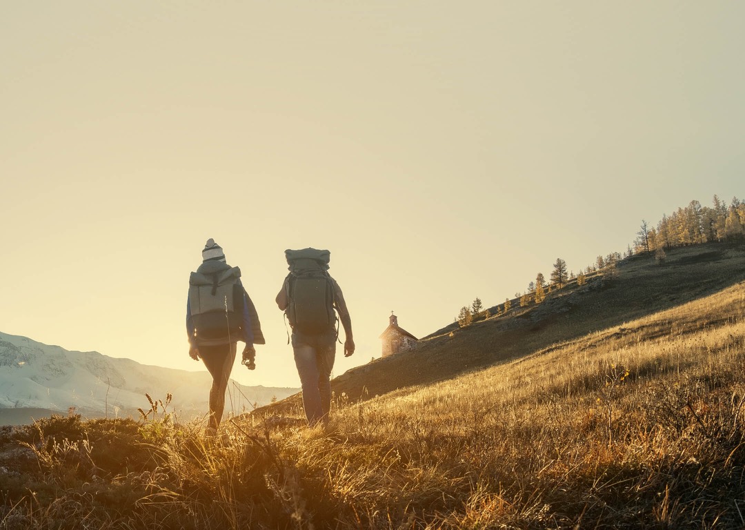 Group of people walking along a mountain ridge